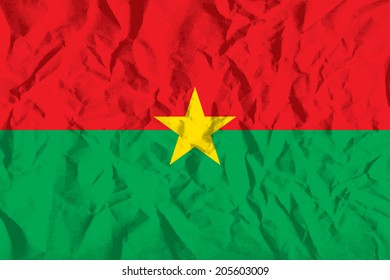 Flag of Burkina Faso on wrinkled paper vector illustration.