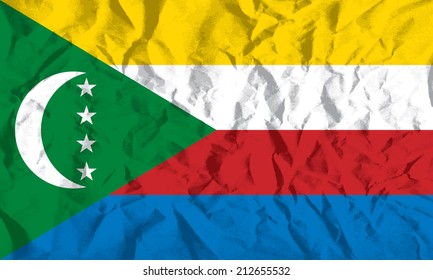 Flag of Comoros on wrinkled paper vector illustration.