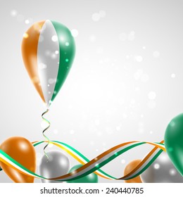 Flag of Cote dIvoire on balloon. Celebration and gifts. Ribbon in the colors are twisted. Balloons on the feast of the national day. 