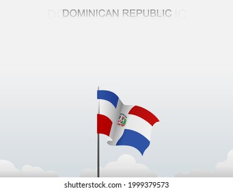 The flag of the Dominican Republic flying on a pole that stands tall against a white sky langit