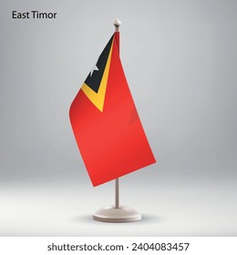 Flag of East Timor hanging on a flag stand. Usable for summit or conference presentaiton