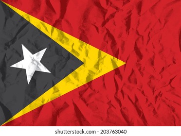 Flag of East Timor on wrinkled paper vector illustration.