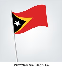 Flag of east timor , east timor flag waving isolated vector illustration,National flag of East Timor: black triangle with white star within bigger yellow one on red background.