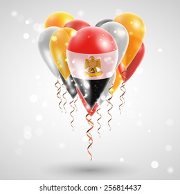 Flag of Egypt on air balls in heart-shaped. Celebration and gifts. Ribbon in the colors are twisted under the balloon. Independence Day. Balloons on the feast of the national