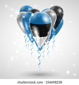 Flag of Estonia on air balls in heart-shaped. Celebration and gifts. Ribbon in the colors are twisted under the balloon. Independence Day. Balloons on the feast of the national