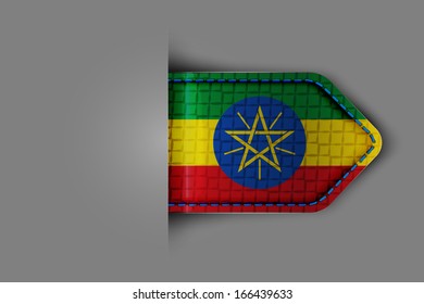 Flag of Ethiopia in the form of a glossy textured label or bookmark. Vector illustration.