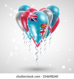 Flag of Fiji on air balls in heart-shaped. Celebration and gifts. Ribbon in the colors oare twisted under the balloon. Independence Day. Balloons on the feast of the national