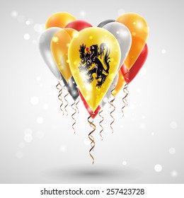 Flag of Flanders on air balls in heart-shaped. Celebration and gifts. Ribbon in the colors are twisted under the balloon. Independence Day. Balloons on feast of the national