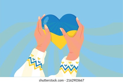 Flag in the form of a heart in the hands of Ukrainian women.Love and care for Ukraine