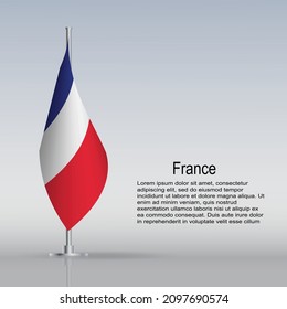 Flag of France hanging on a flagpole stands on the table. Vector illustration