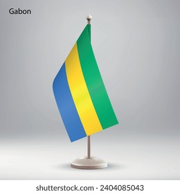 Flag of Gabon hanging on a flag stand. Usable for summit or conference presentaiton
