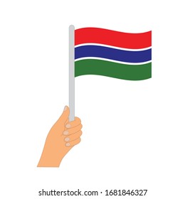 Flag of Gambia  . Hand holding a Gambia  flag - vector icon.