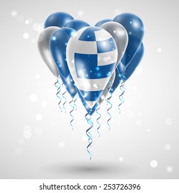 Flag of Greece on air balls in heart-shaped. Celebration and gifts. Ribbon in the colors are twisted under the balloon. Independence Day. Balloons on the feast of the national