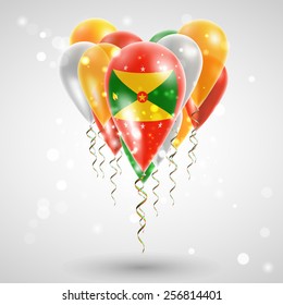 Flag of Grenada on air balls in heart-shaped. Celebration and gifts. Ribbon in the colors are twisted under the balloon. Independence Day. Balloons on the feast of the national