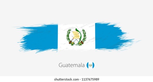 Flag of Guatemala, grunge abstract brush stroke on gray background. Vector illustration.