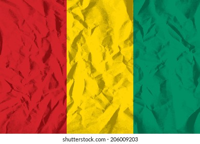 Flag of Guinea on wrinkled paper vector illustration.