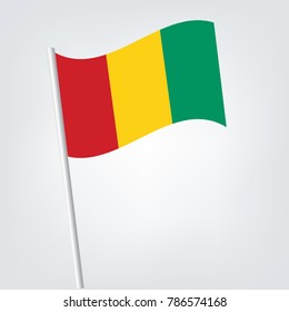 Flag of Guinea , Guinea flag waving isolated vector illustration,vector waving simple triangle malian flag on slanted pole - icon of mali with metal stick.