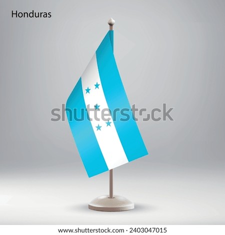 Flag of Honduras hanging on a flag stand. Usable for summit or conference presentaiton