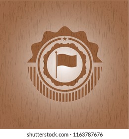 flag icon inside badge with wood background