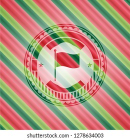 flag icon inside christmas badge.