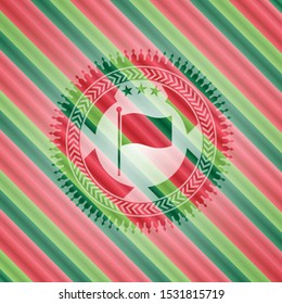 flag icon inside christmas colors badge.