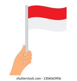 Flag of Indonesia . Hand holding a Indonesia flag - vector icon.