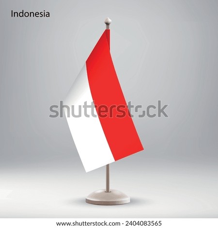 Flag of Indonesia hanging on a flag stand. Usable for summit or conference presentaiton