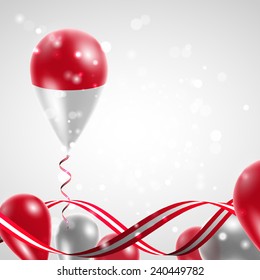 Flag of Indonesia on balloon. Celebration and gifts. Ribbon in the colors are twisted. Balloons on the feast of the national day. 