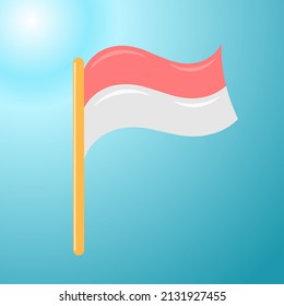 The flag of the Indonesian state that is caressed by the wind in the beautiful blue sky