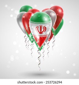 Flag of Iran on air balls in heart-shaped. Celebration and gifts. Ribbon in the colors are twisted under the balloon. Independence Day. Balloons on the feast of the national