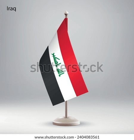 Flag of Iraq hanging on a flag stand. Usable for summit or conference presentaiton