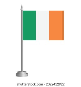 Flag of Ireland flying on a flagpole stands on the table. Vector illustration