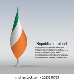 Flag of Ireland hanging on a flagpole stands on the table. Vector illustration