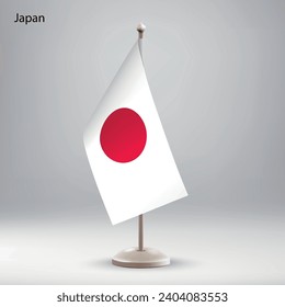 Flag of Japan hanging on a flag stand. Usable for summit or conference presentaiton