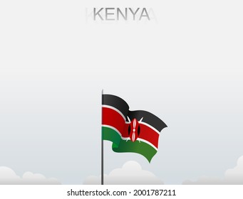Die Flagge Kenias fliegt auf einem Stein, der hoch unter dem weißen Himmel steht