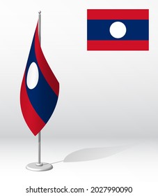 flag of Lao People Democratic Republic on flagpole for registration of solemn event, meeting foreign guests. National independence day of Lao. Realistic 3D vector on white
