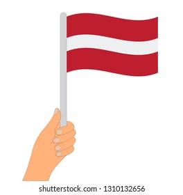 Flag of Latvia . Hand holding a Latvia flag - vector icon.