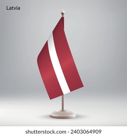Flag of Latvia hanging on a flag stand. Usable for summit or conference presentaiton