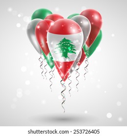 Flag of Lebanon on air balls in heart-shaped. Celebration and gifts. Ribbon in the colors are twisted under the balloon. Independence Day. Balloons on the feast of the national