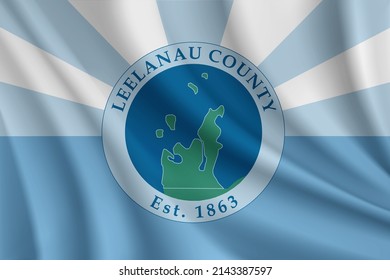 Flag of Leelanau County, Michigan, USA. Realistic waving flag of Leelanau Countyh vector background.