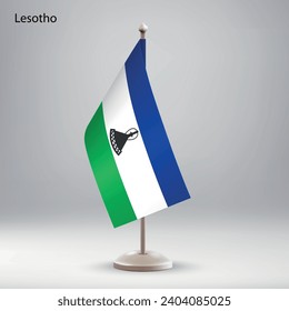 Flag of Lesotho hanging on a flag stand. Usable for summit or conference presentaiton