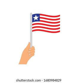 Flag of Liberia  . Hand holding a Liberia  flag - vector icon.