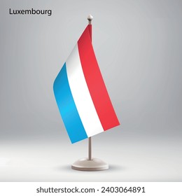 Flag of Luxembourg hanging on a flag stand. Usable for summit or conference presentaiton