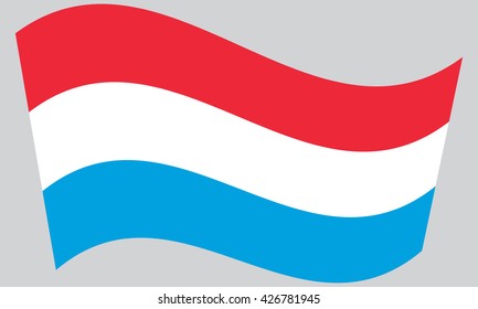 Flag of Luxembourg waving on gray background