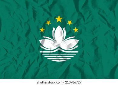 Flag of Macau on wrinkled paper vector illustration.
