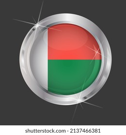 Flag of Madagascar in circle. 3D effect. Glossy and shiny button with metal frame and sparkles. Light reflection. Round Graphic design element. Isolated on gray background. Vector image EPS 10. 