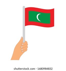 Bandera de Maldivas. Mano sosteniendo una bandera de Maldivas - icono vector.
