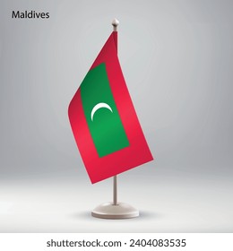 Flag of Maldives hanging on a flag stand. Usable for summit or conference presentaiton