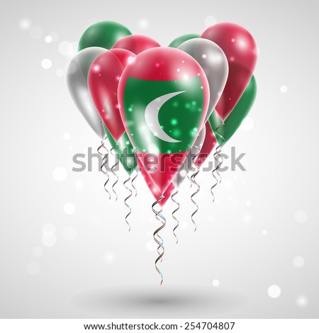 Flag of the Maldives on air balls in heart-shaped. Celebration and gifts. Ribbon in the colors are twisted under the balloon. Independence Day. Balloons on the feast of the national