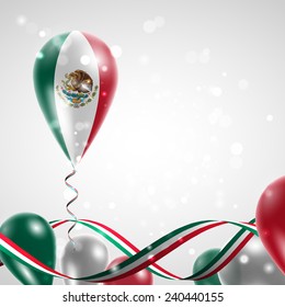 Flag of Mexico on balloon. Celebration and gifts. Ribbon in the colors are twisted. Balloons on the feast of the national day. 